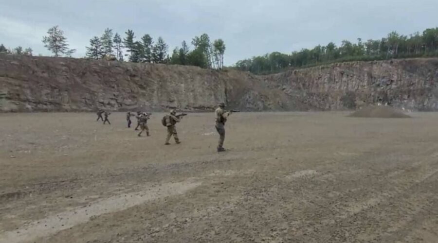 Four, including military members, charged in relation to terrorist group