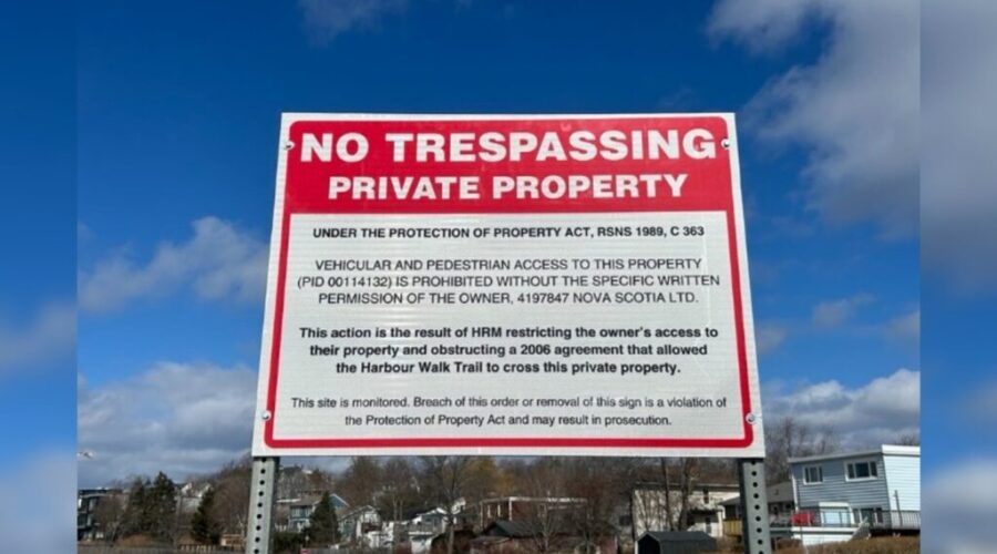 Company pushing to infill Dartmouth Cove puts up no trespassing signs